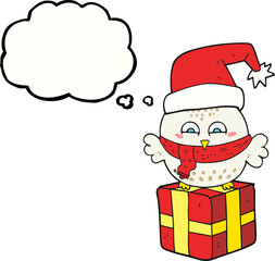 freehand drawn thought bubble cartoon cute christmas owl on wrapped present