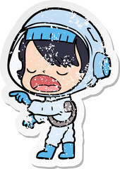distressed sticker of a cartoon astronaut woman pointing and talking