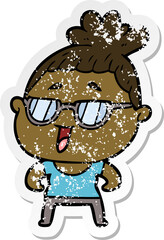 distressed sticker of a cartoon happy woman wearing spectacles