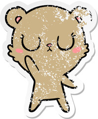 distressed sticker of a peaceful cartoon bear