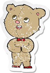 retro distressed sticker of a cartoon cute teddy bear
