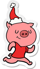 happy hand drawn sticker cartoon of a pig running wearing santa hat