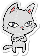 distressed sticker of a cartoon cat staring