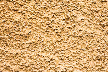 Yellow mineral background. Tile adhesive texture. Facade plaster background. Plaster grains pattern. Home renovation texture. Granules backdrop. Stucco wall background. Grunge cement texture.