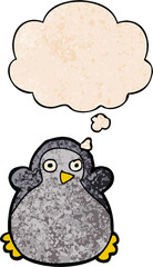 cartoon penguin with thought bubble in grunge texture style