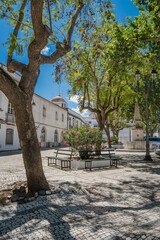 Cobblestone yard with trees and old Côrro fountain from 1887, Serpa - Alentejo PORTUGAL