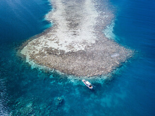 Scenic Aerial Drone Picture of the Outer Reef Atoll and a Boat of Pohnpei, Micronesia 