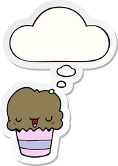 cartoon cupcake with face with thought bubble as a printed sticker