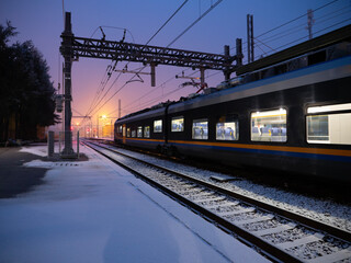 Fototapeta premium train station winter snow in the morning