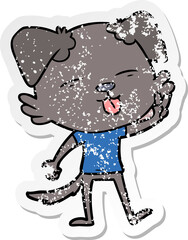 distressed sticker of a cartoon dog sticking out tongue