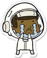 sticker of a cartoon crying astronaut