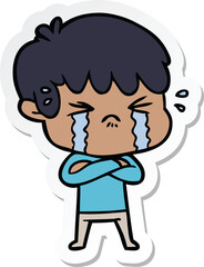 sticker of a cartoon boy crying