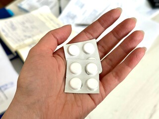 doctor holding pills