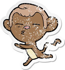 distressed sticker of a cartoon suspicious monkey