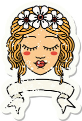 worn old sticker with banner of female face with eyes closed