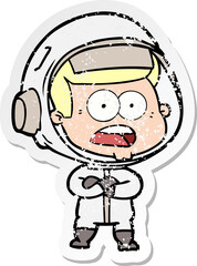 distressed sticker of a cartoon surprised astronaut