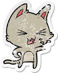 distressed sticker of a cartoon cat hissing
