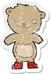 Obraz premium retro distressed sticker of a cartoon teddy bear wearing boots