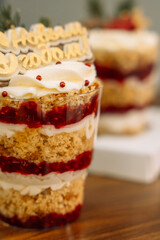 Christmas trifle in a glass glass with fruit filling.