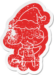 quirky cartoon distressed sticker of a smiling elephant wearing scarf wearing santa hat