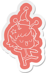 happy alien girl quirky cartoon  sticker of a wearing santa hat