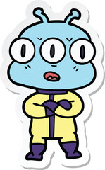 sticker of a cartoon three eyed alien