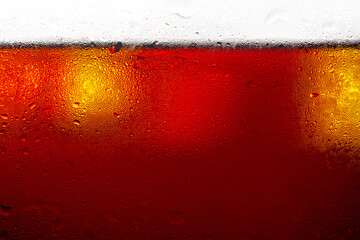 Soft drink glass with ice splash on dark background. Cola glass in celebration party concept.  - obrazy, fototapety, plakaty