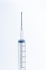 Macro syringe,A 5ml syringe and needle isolated on a white background with detailed clipping path,Close up of a syringe. Focus on numbers