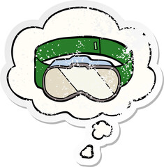 cartoon goggles with thought bubble as a distressed worn sticker