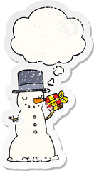 cartoon christmas snowman with thought bubble as a distressed worn sticker