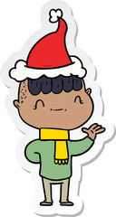 Obraz premium hand drawn sticker cartoon of a friendly boy wearing santa hat