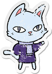 distressed sticker of a cartoon cat staring
