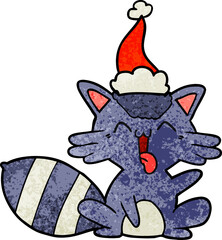 cute hand drawn textured cartoon of a raccoon wearing santa hat