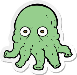 sticker of a cartoon alien squid face