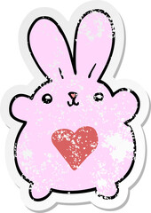distressed sticker of a cute cartoon rabbit with love heart