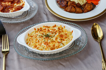 Baked Spinach with Cheese on a white plate on the table