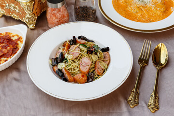 Spaghetti with spicy mixed sausage. Fusion Food.