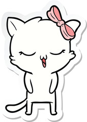 sticker of a cartoon cat with bow on head