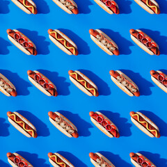 Seamless Pattern of Colorful Hot Dogs with Condiments on Vivid Blue Backdrop