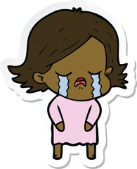 sticker of a cartoon girl crying