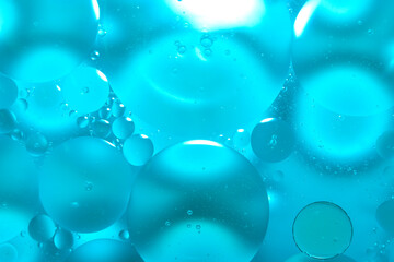 Oil drop background on blue water surface It is natural and abstract.