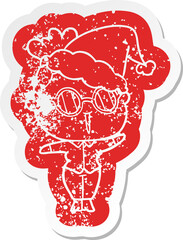 quirky cartoon distressed sticker of a woman wearing spectacles wearing santa hat