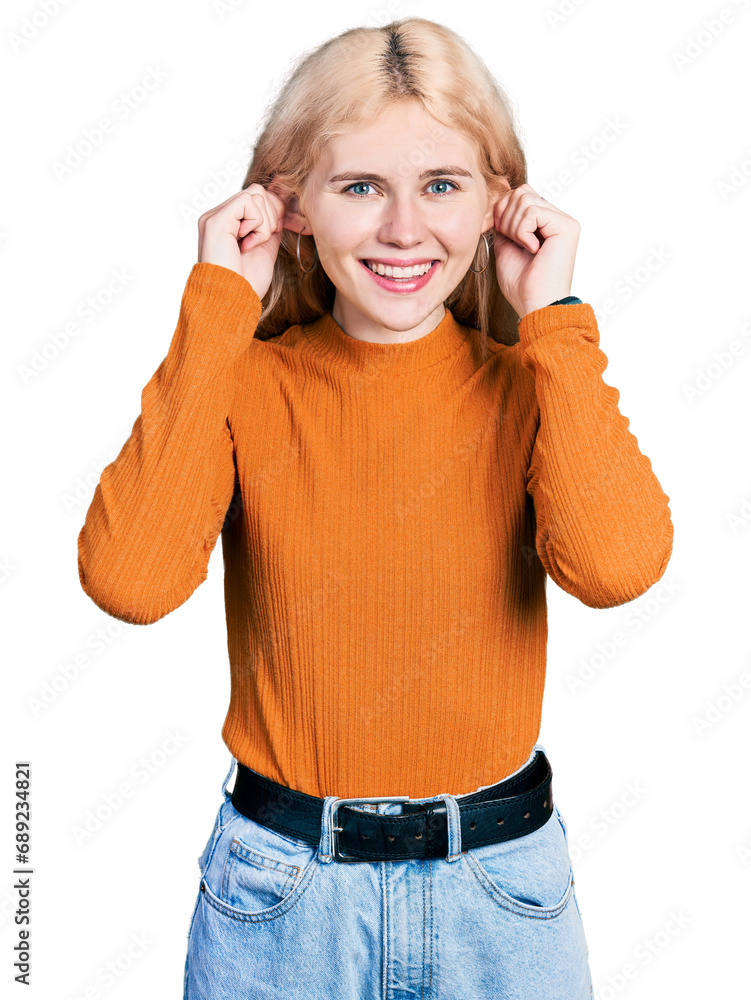 Sticker young caucasian woman wearing casual clothes smiling pulling ears with fingers, funny gesture. audit