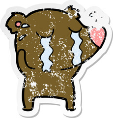 distressed sticker of a cartoon crying bear