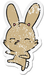 distressed sticker of a curious bunny cartoon