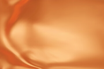 Close-up texture of natural orange silk. Bright Orange fabric smooth texture surface background. Smooth elegant silk in vivid toned. Texture, background, pattern, template.