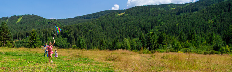Fototapeta premium A family flies a kite in nature. Selective focus.