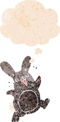 cartoon rabbit with thought bubble in grunge distressed retro textured style