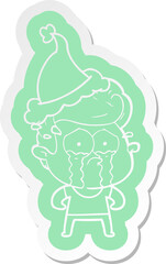 quirky cartoon  sticker of a crying man wearing santa hat
