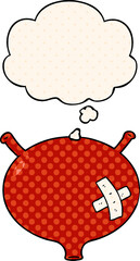cartoon bladder with thought bubble in comic book style